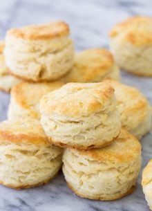 Homemade biscuits stacked after baking.