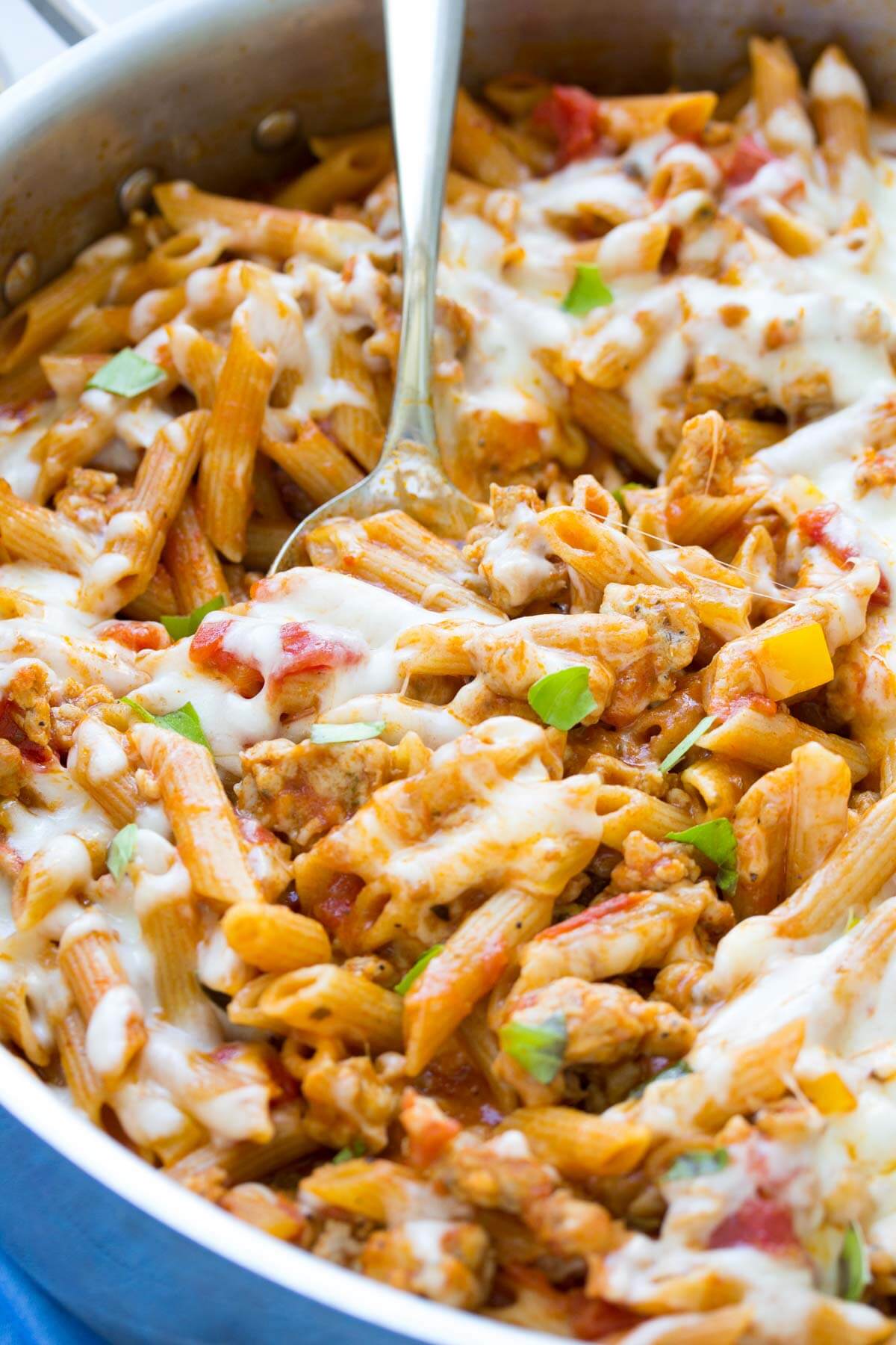 cheesy one pot pasta with sausage in a skillet