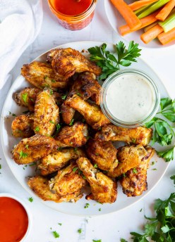 air fryer chicken wings served with ranch dressing and buffalo sauce