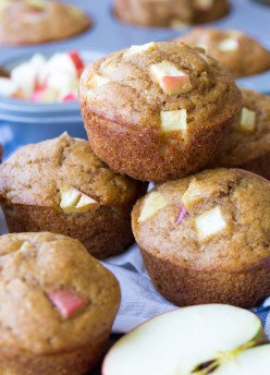 These healthy apple muffins are quick and easy to make in one bowl! This whole wheat muffins recipe is made with applesauce, fresh apples and cinnamon. Make a batch of these best apple muffins for your freezer this fall!