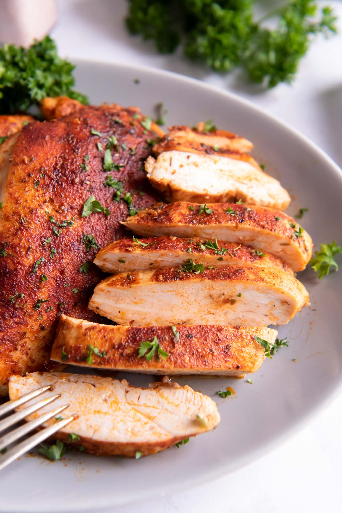 Sliced chicken breast on a plate.