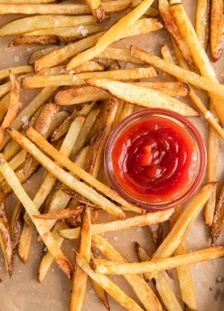 Oven baked french fries served with a dish of ketchup
