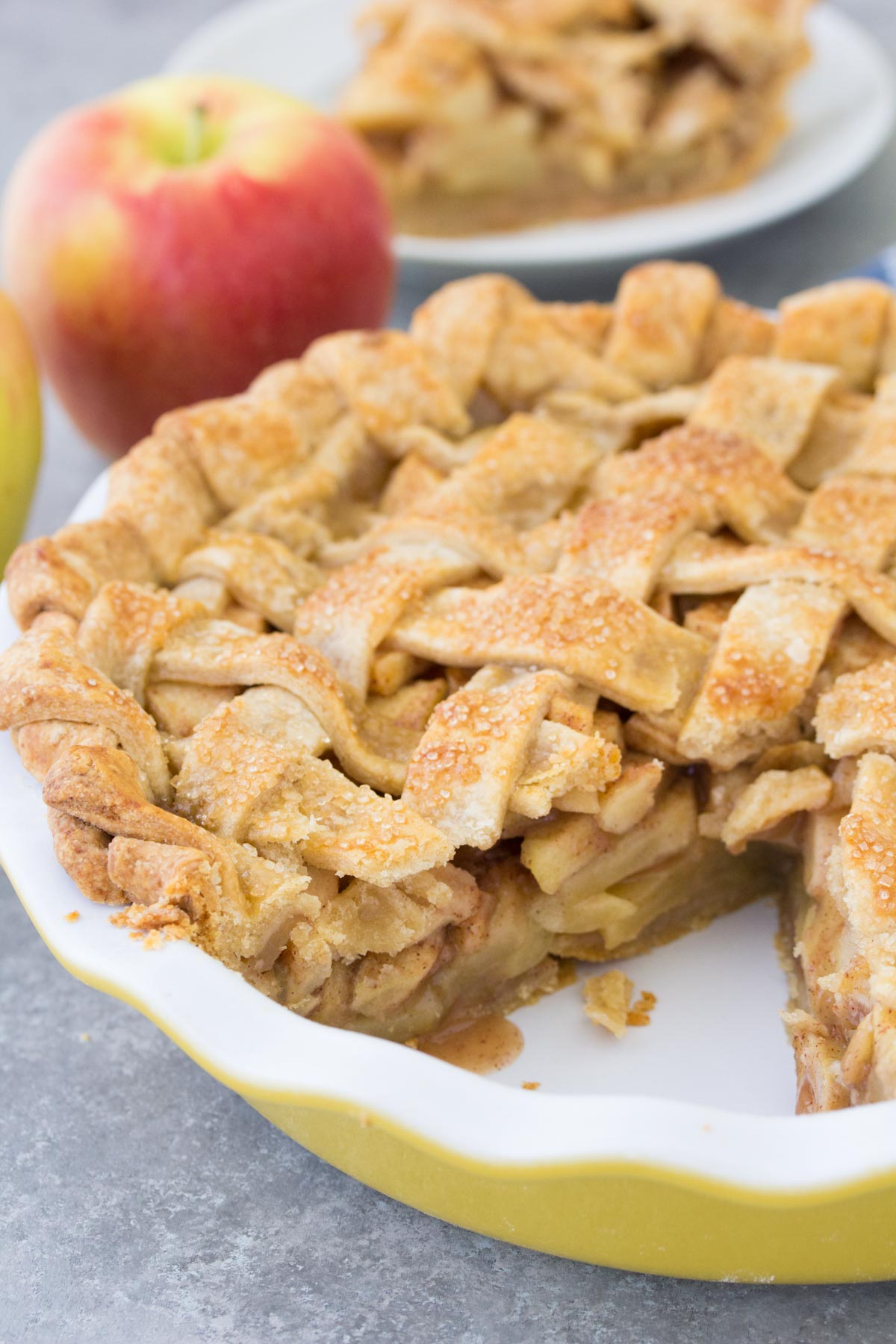 Apple pie with slice cut out.