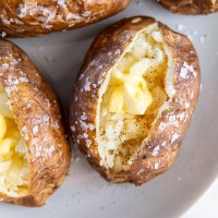 baked potato topped with butter, salt and pepper