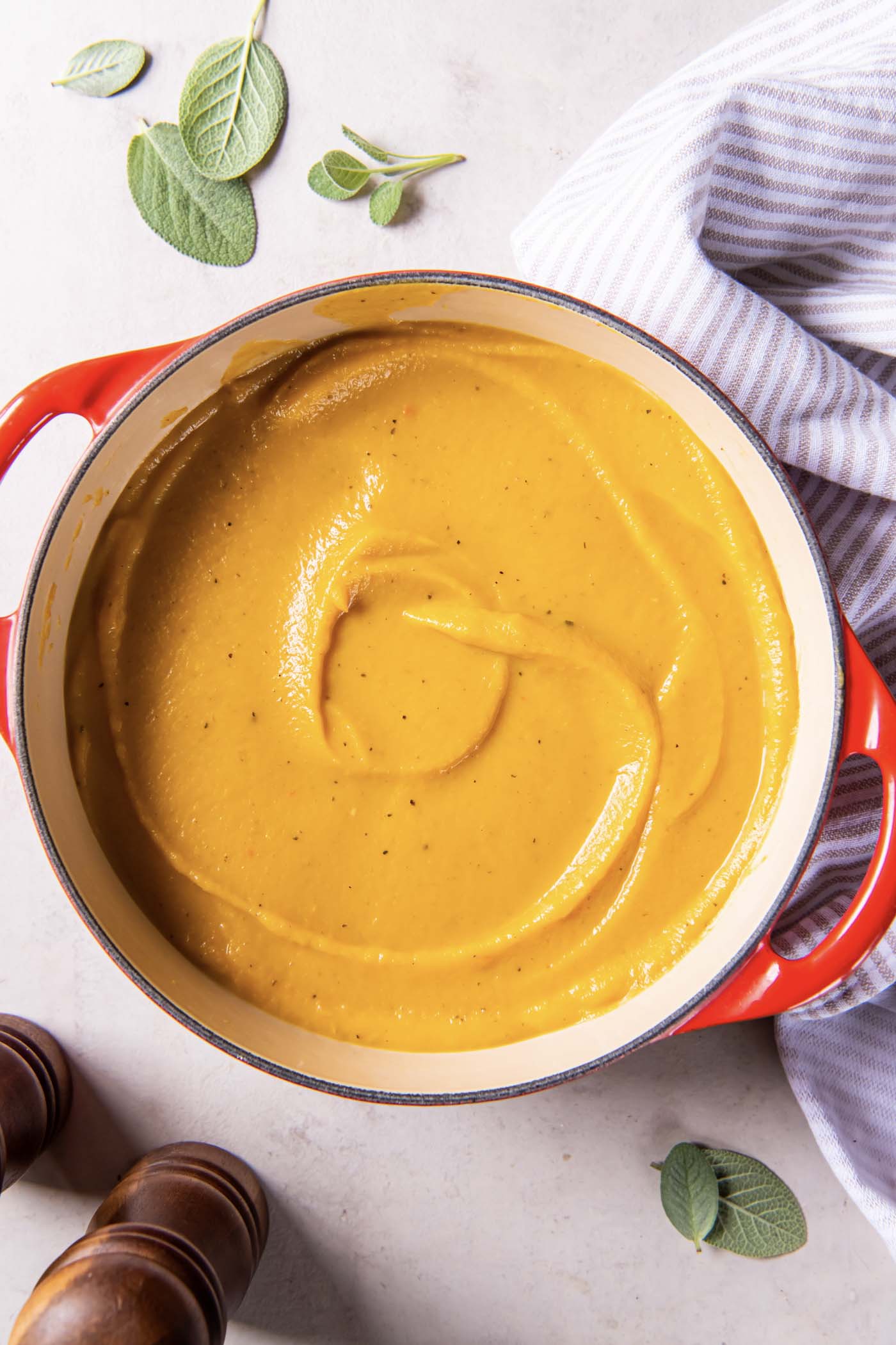 Pureed butternut squash soup in a Dutch oven pot.