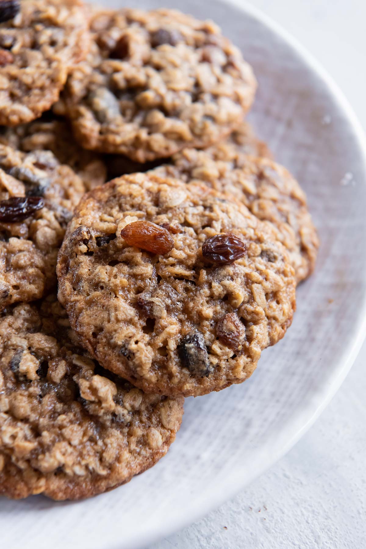 Close up of oatmeal raisin cookies on a plate.