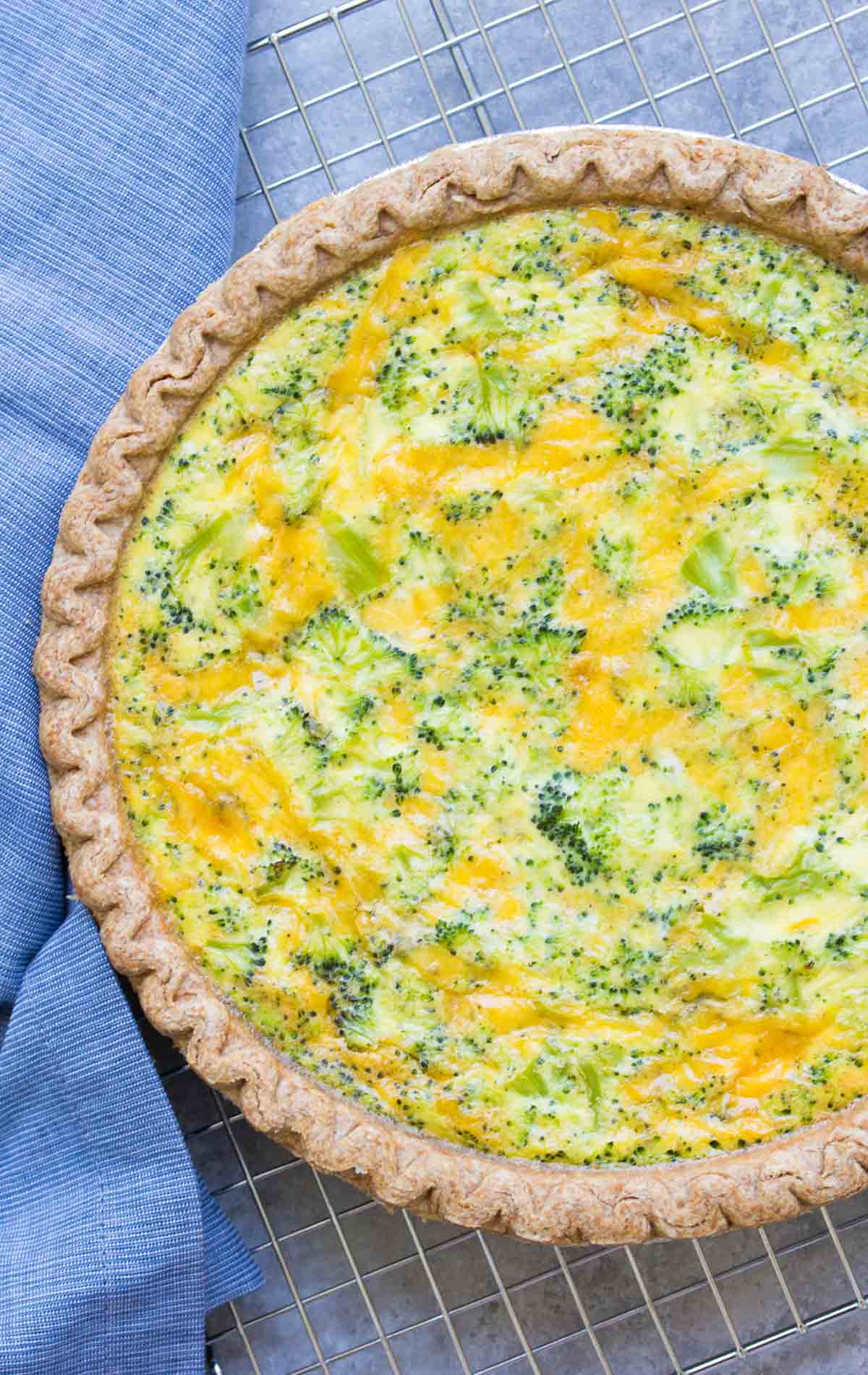 An easy broccoli cheese quiche recipe, made with just 5 ingredients! This broccoli cheddar quiche is a family favorite for dinner, breakfast or lunch!