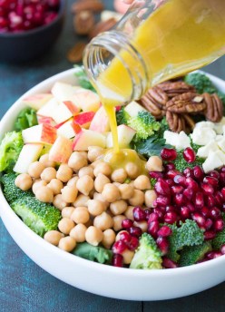 This Broccoli Kale Superfood Salad is a healthy holiday side dish. It's also delicious for lunch! With chickpeas, pomegranate seeds, apple, pecans and feta cheese.