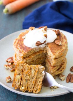Healthy Carrot Cake Pancakes with maple yogurt are great for breakfast or kids' lunch boxes! Top them with maple Greek yogurt and toasted nuts or serve with maple syrup. These easy carrot cake pancakes are refined sugar free and freeze well for meal prep breakfasts.