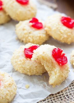 Cherry Cream Cheese Cookies. My family bakes these every year at Christmas! These holiday cookies are rolled in nuts and topped with a maraschino cherry. They are melt-in-your-mouth good!