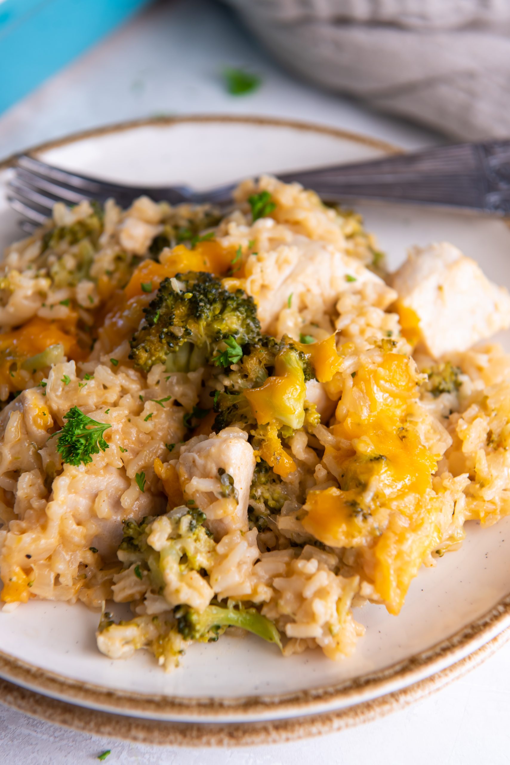 Serving of chicken broccoli rice casserole on a plate.
