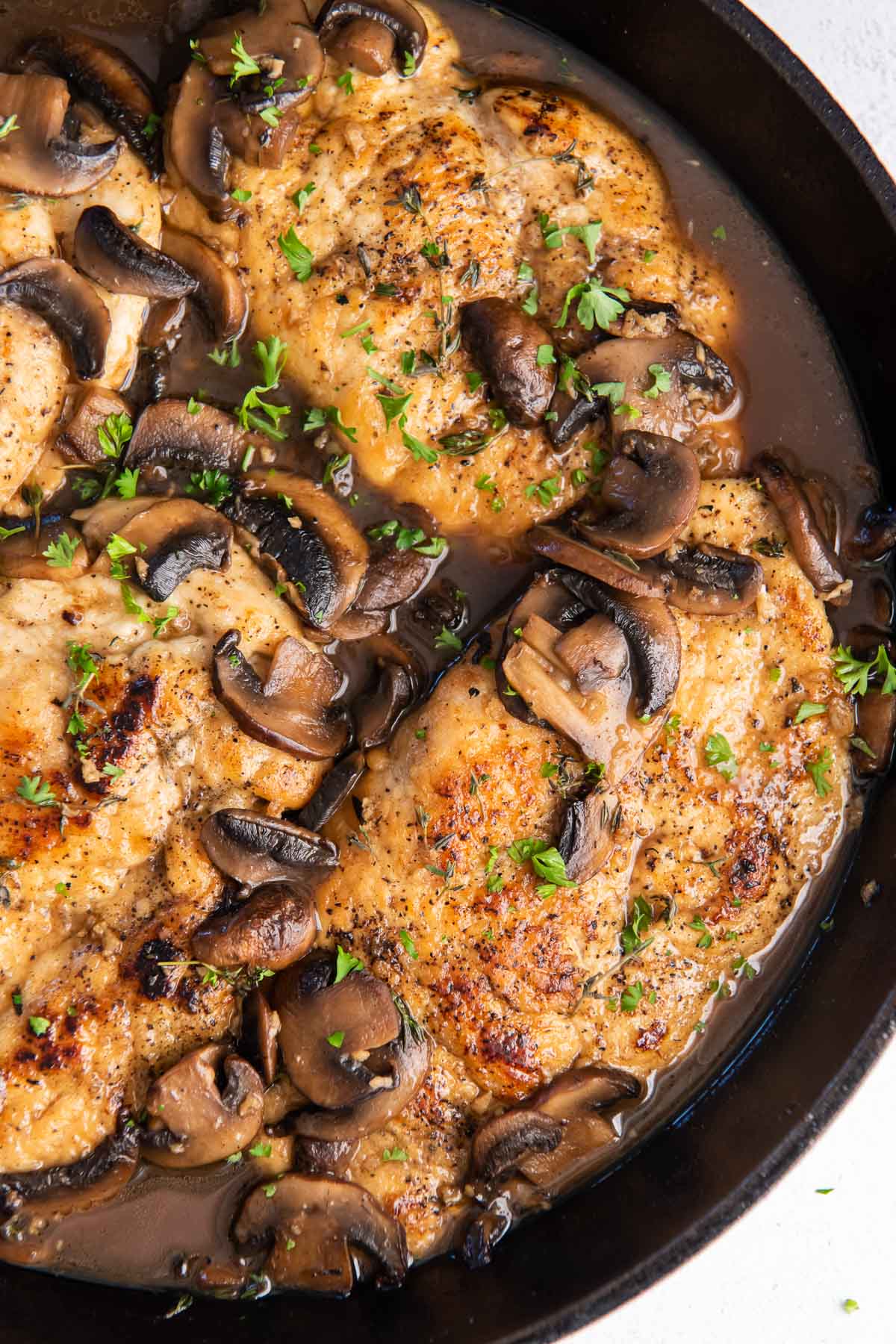 Chicken marsala in a cast iron skillet.