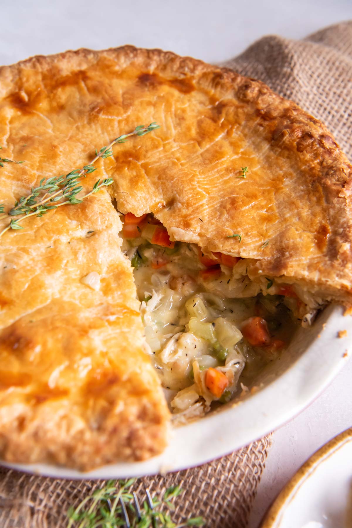 Chicken pot pie with a slice cut out.