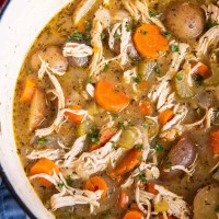 Close up of chicken stew in a pot.