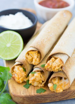 Crispy baked chicken taquitos with a chicken and cheese filling. These taquitos are freezer friendly for quick dinners! The whole family will love them!