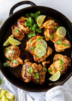 cilantro lime chicken thighs in a cast iron skillet