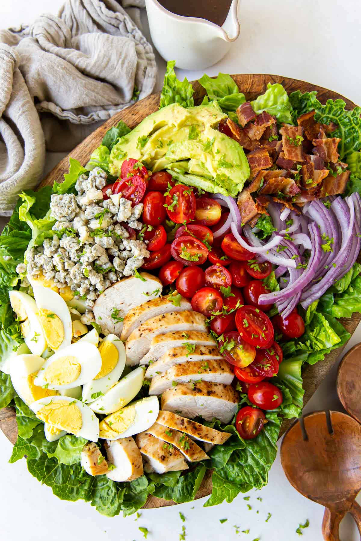 Cobb salad arranged on a large salad platter.