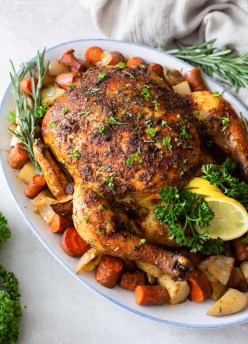 crockpot whole chicken and vegetables on a serving platter