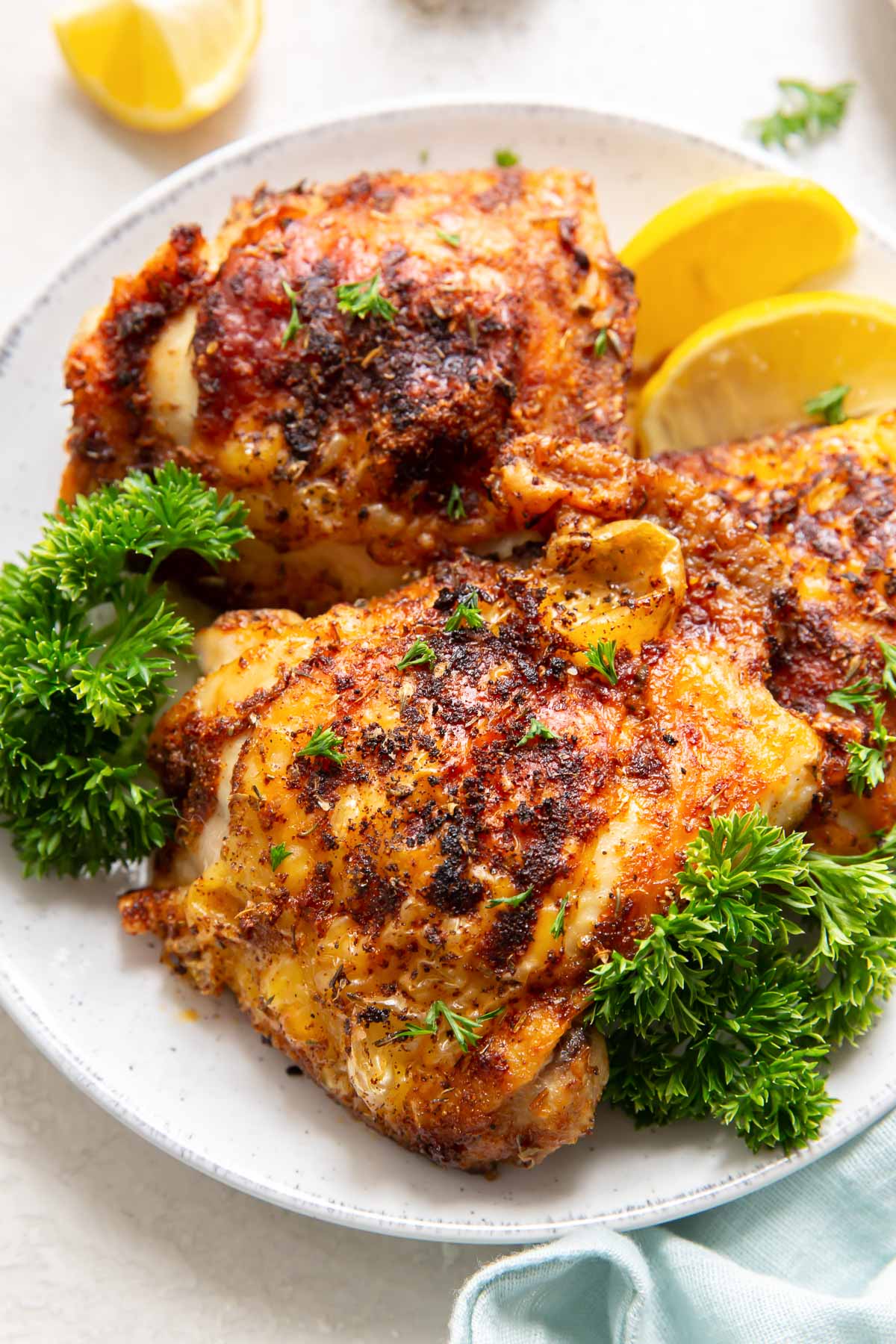 close up of crispy chicken thighs on a plate