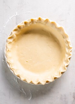 Homemade pie crust in pie dish before baking.