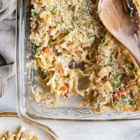 Tuna casserole in baking dish with serving spoon.