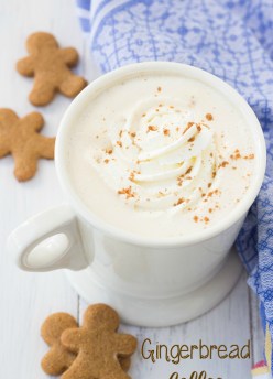 A mug of gingerbread coffee with whipped cream and cinnamon.