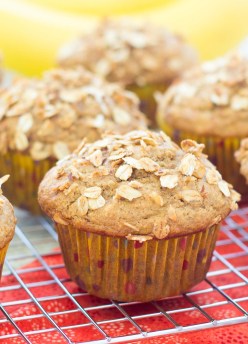 Close up of a banana granola muffin on a wire rack.