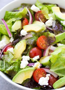 Close up of green salad with avocado.