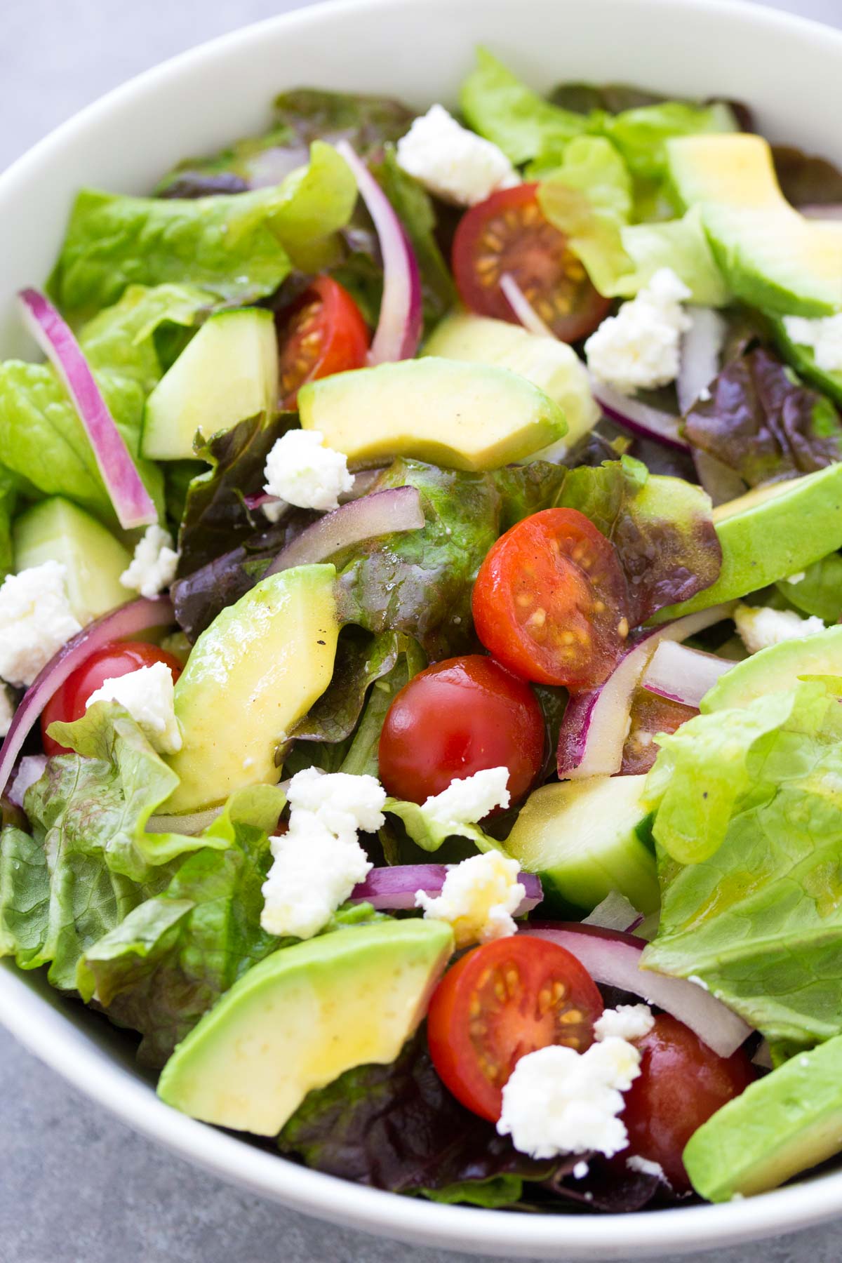 Close up of green salad with avocado.