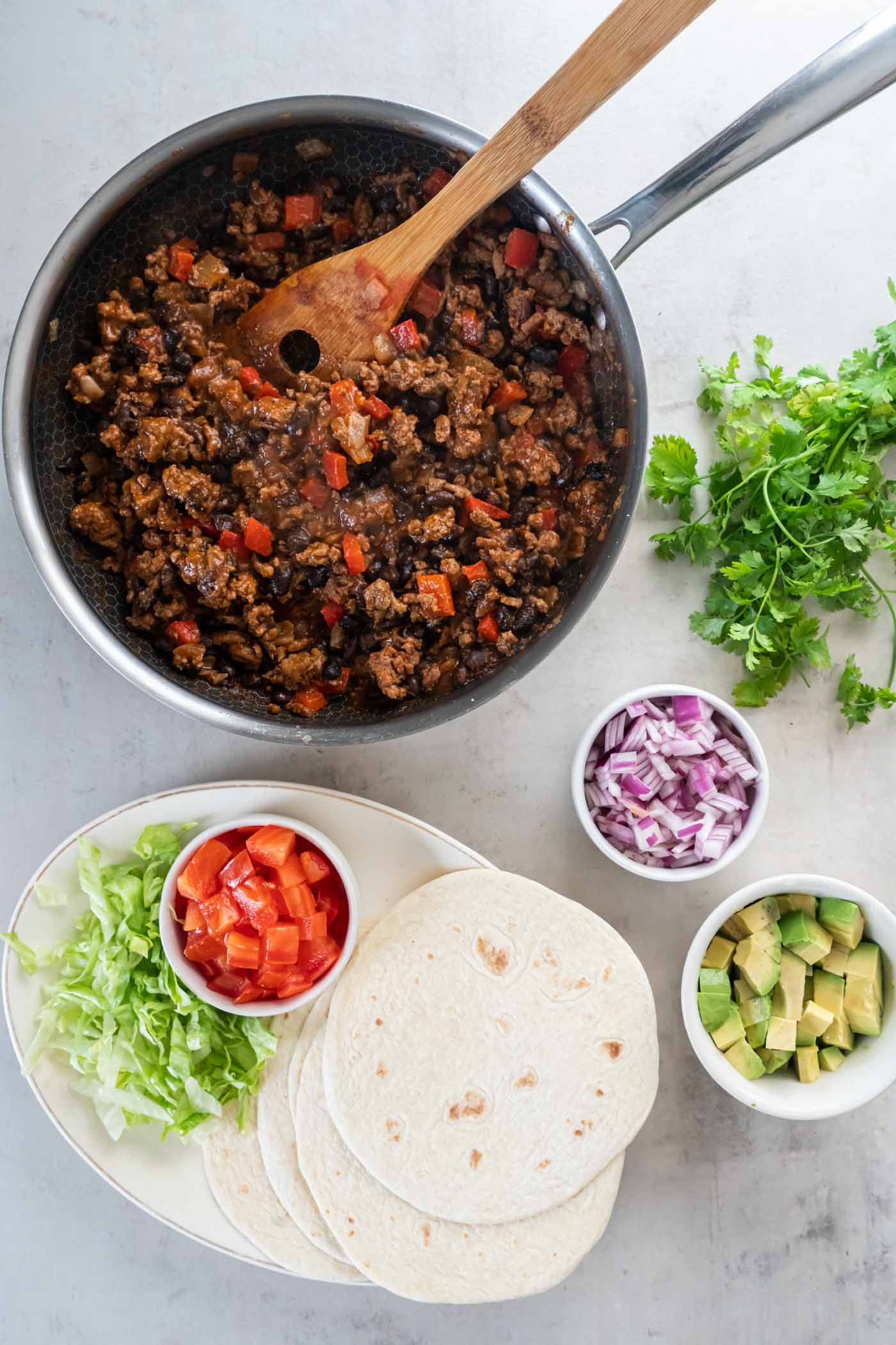 Turkey taco filling, tortillas and taco toppings.