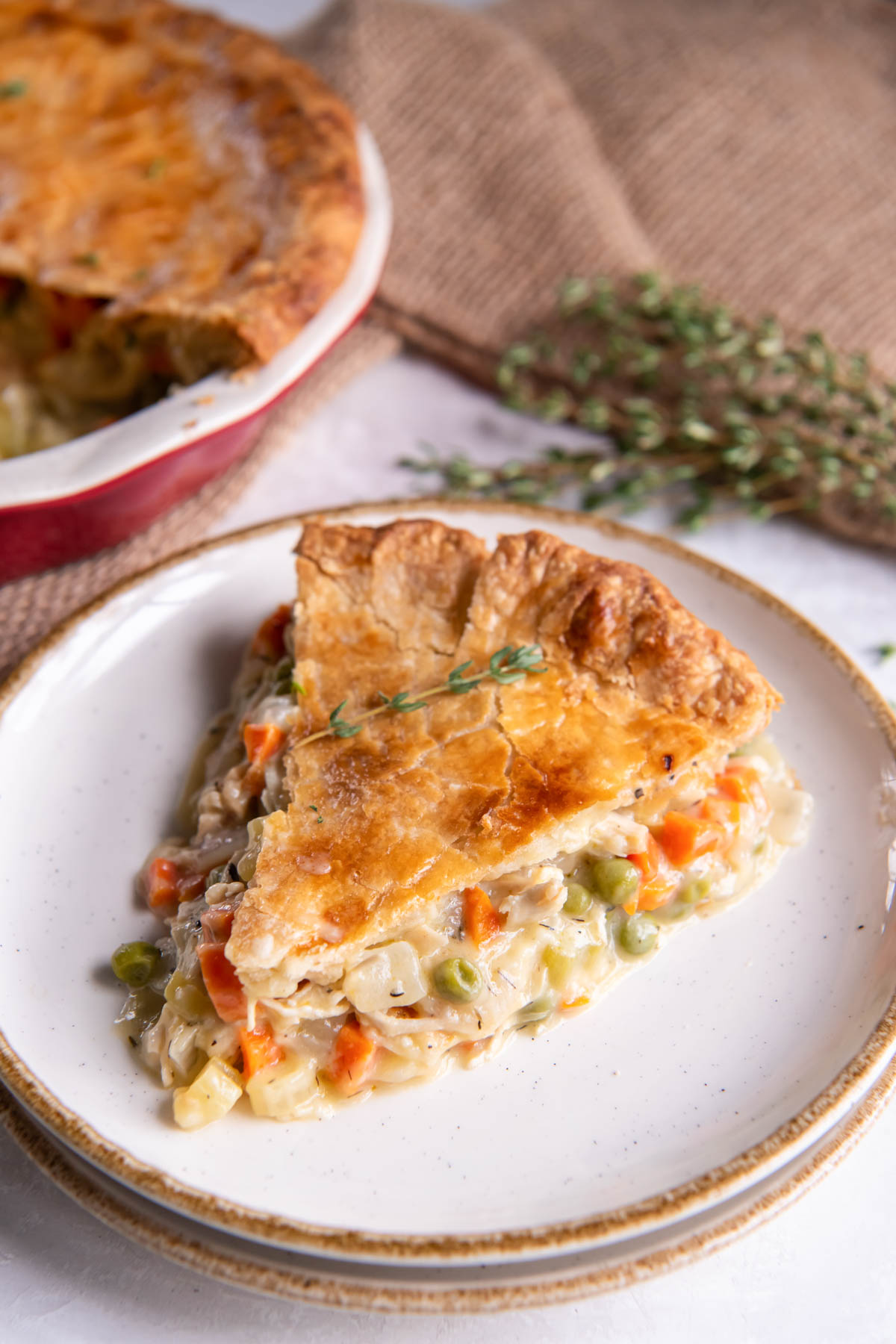 Slice of chicken pot pie on a plate.