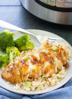 Honey Garlic Instant Pot Chicken Breast served over brown rice, with broccoli on the side.