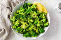 Sautéed broccoli with lemon in a serving bowl.