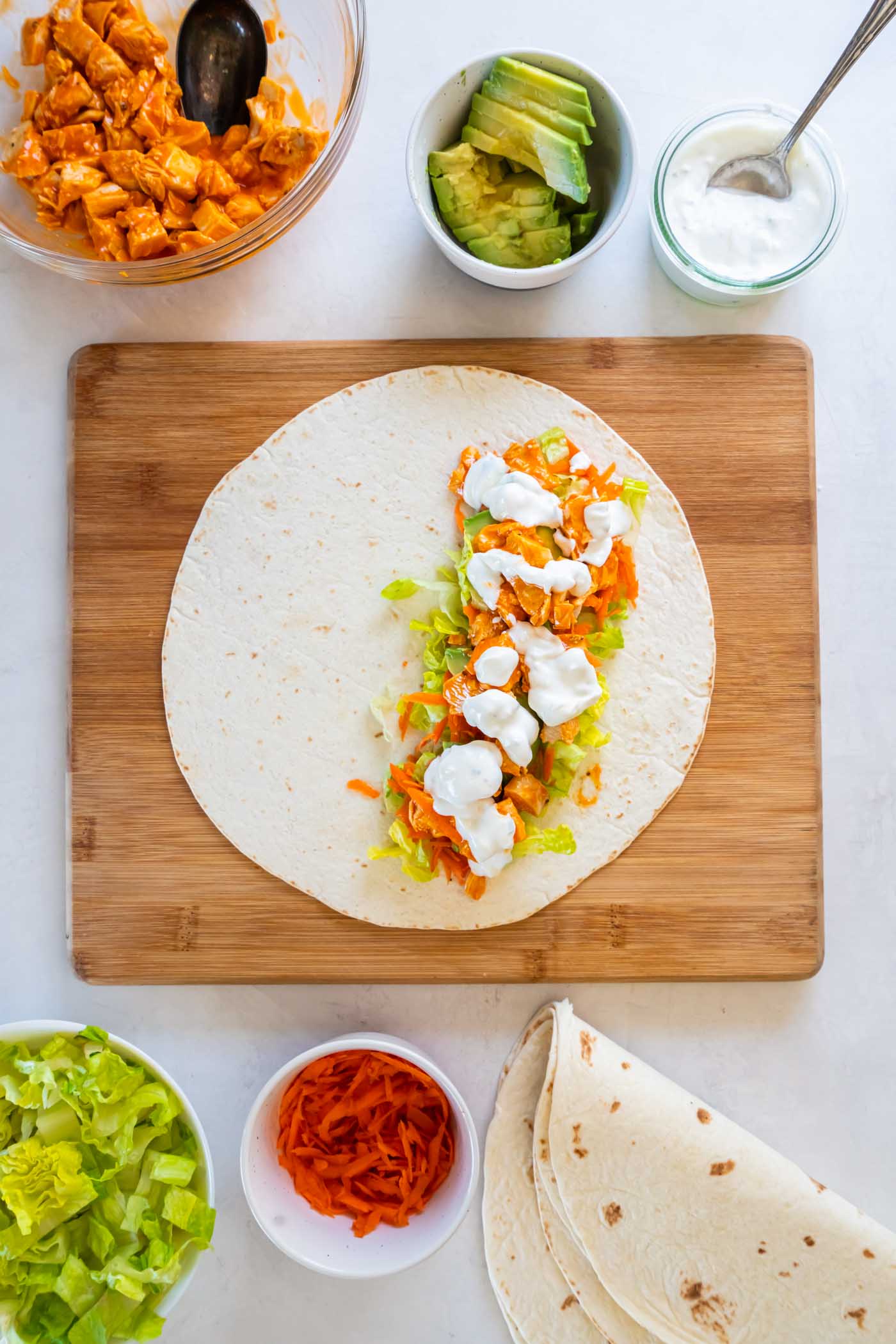 Tortilla with lettuce, shredded carrot, avocado, buffalo chicken and blue cheese dressing.