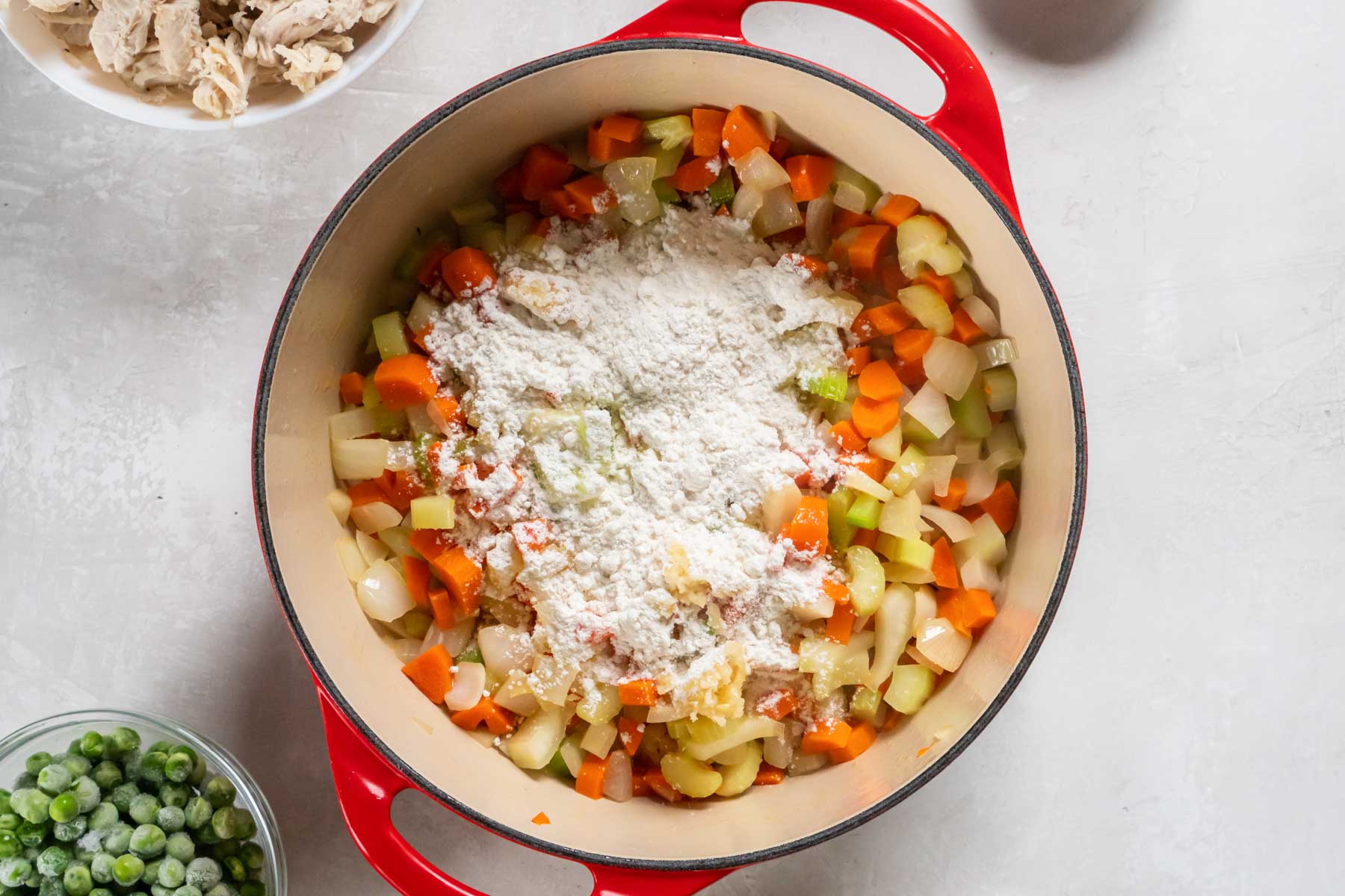 Garlic and flour added to pot.