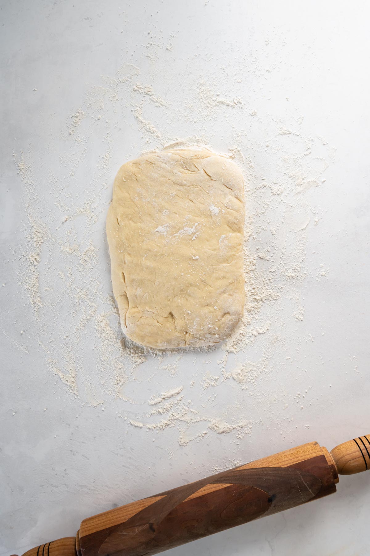 Dough shaped into small rectangle.