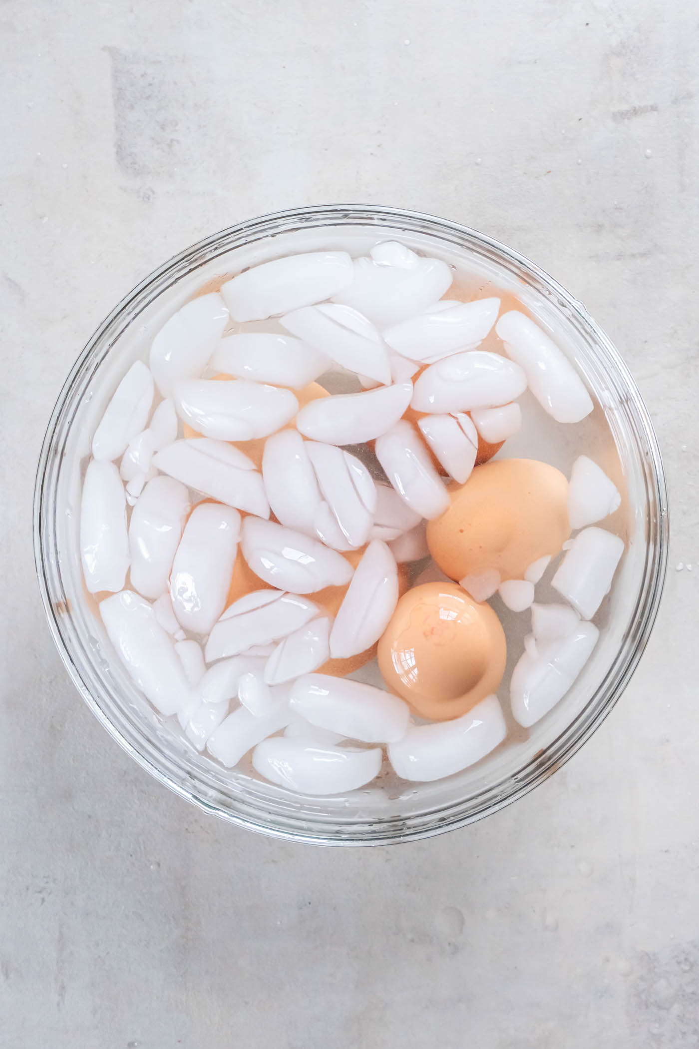 Hard boiled eggs in bowl of ice water.