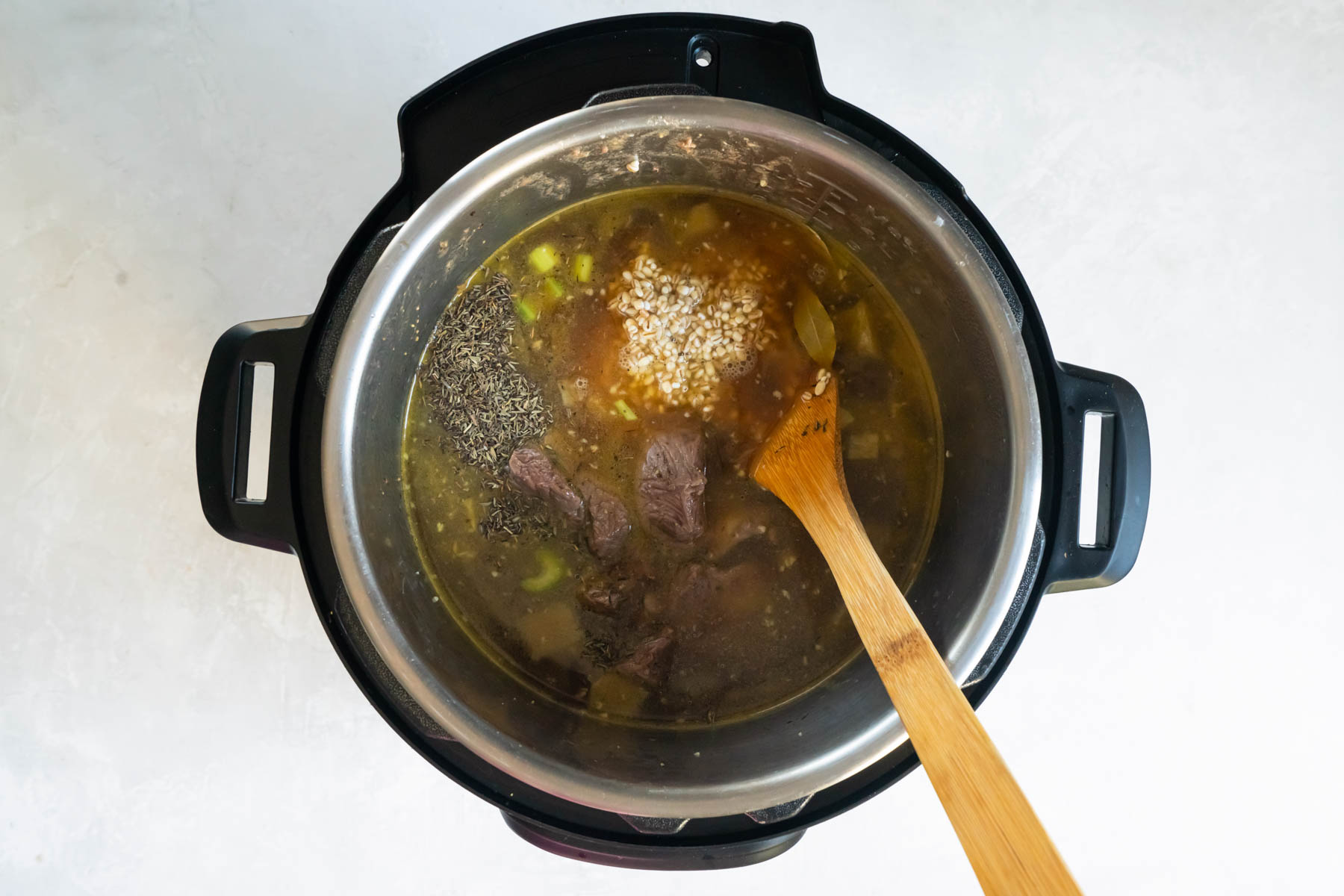 Broth and remaining ingredients added to instant pot.