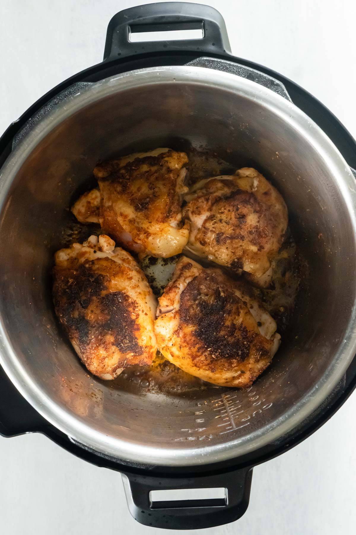 Browning chicken thighs in Instant Pot.