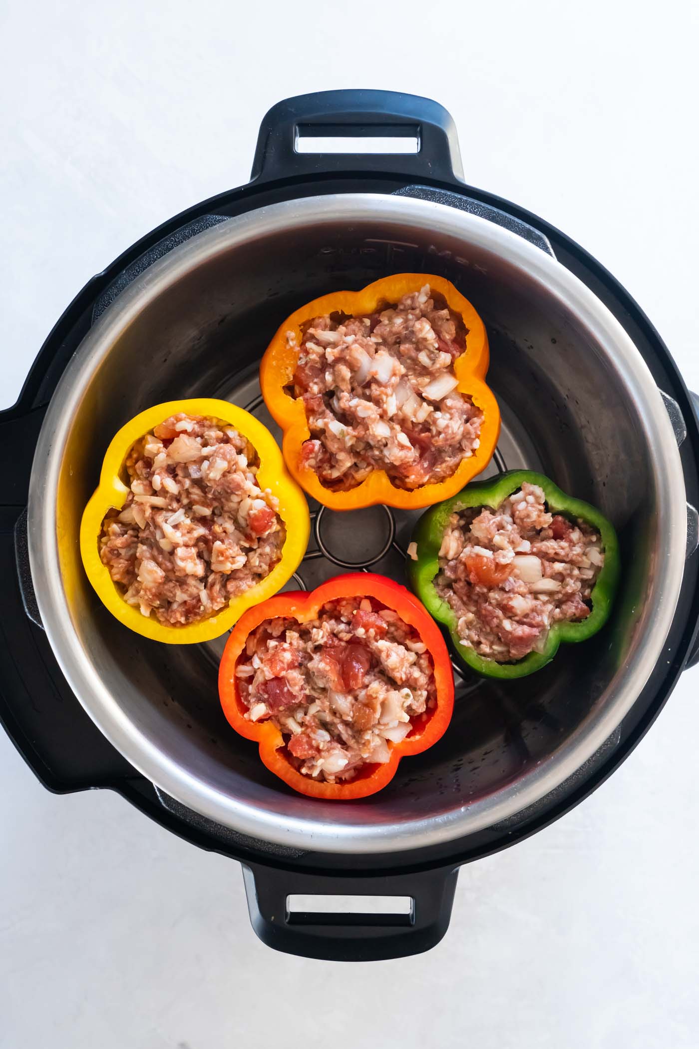 Peppers with ground beef filling in instant pot.