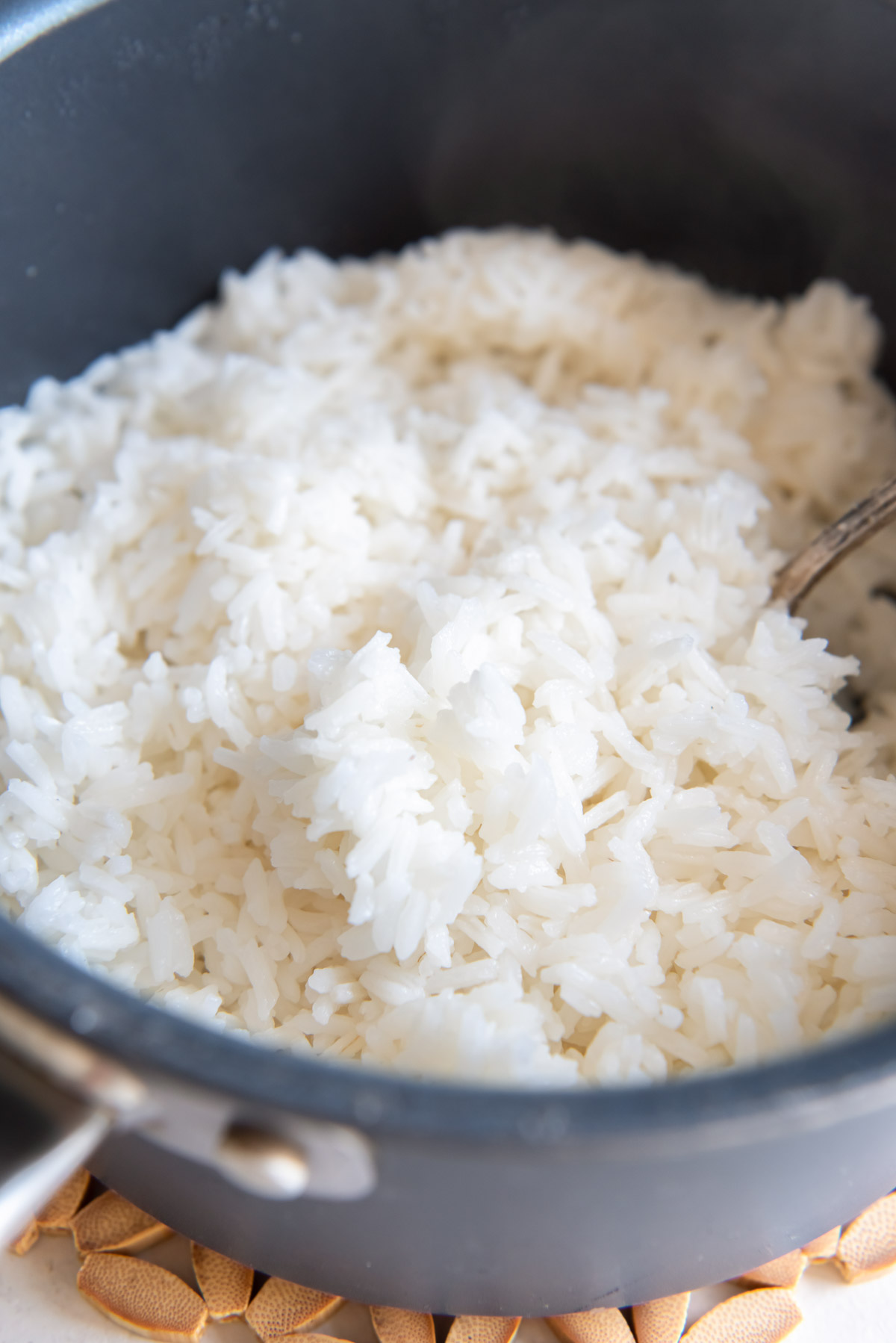 Fluffy cooked white rice in a pot.
