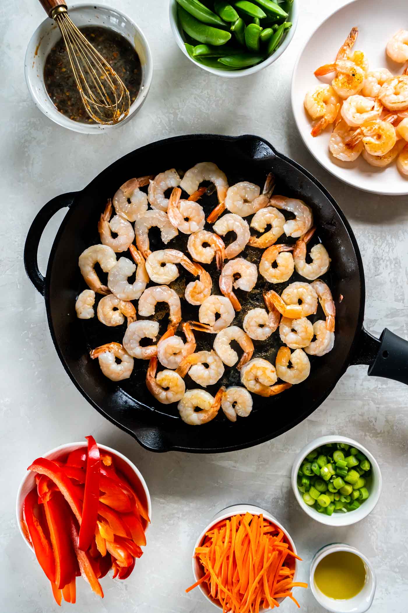 Cooking shrimp in a skillet.