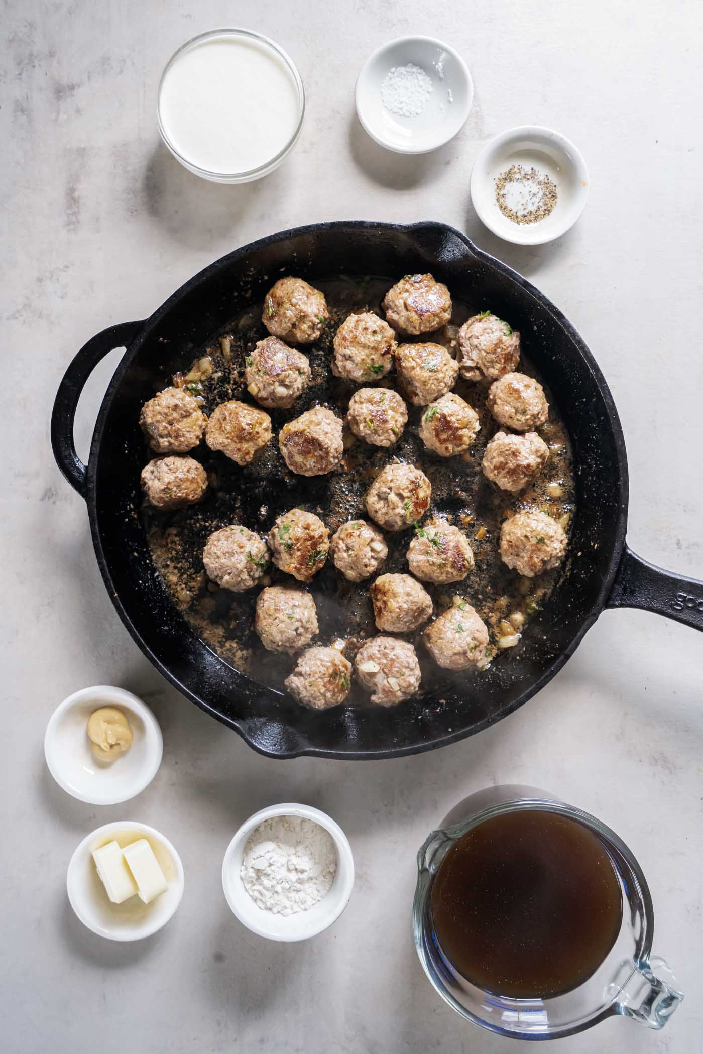 Browning meatballs in cast iron skillet.