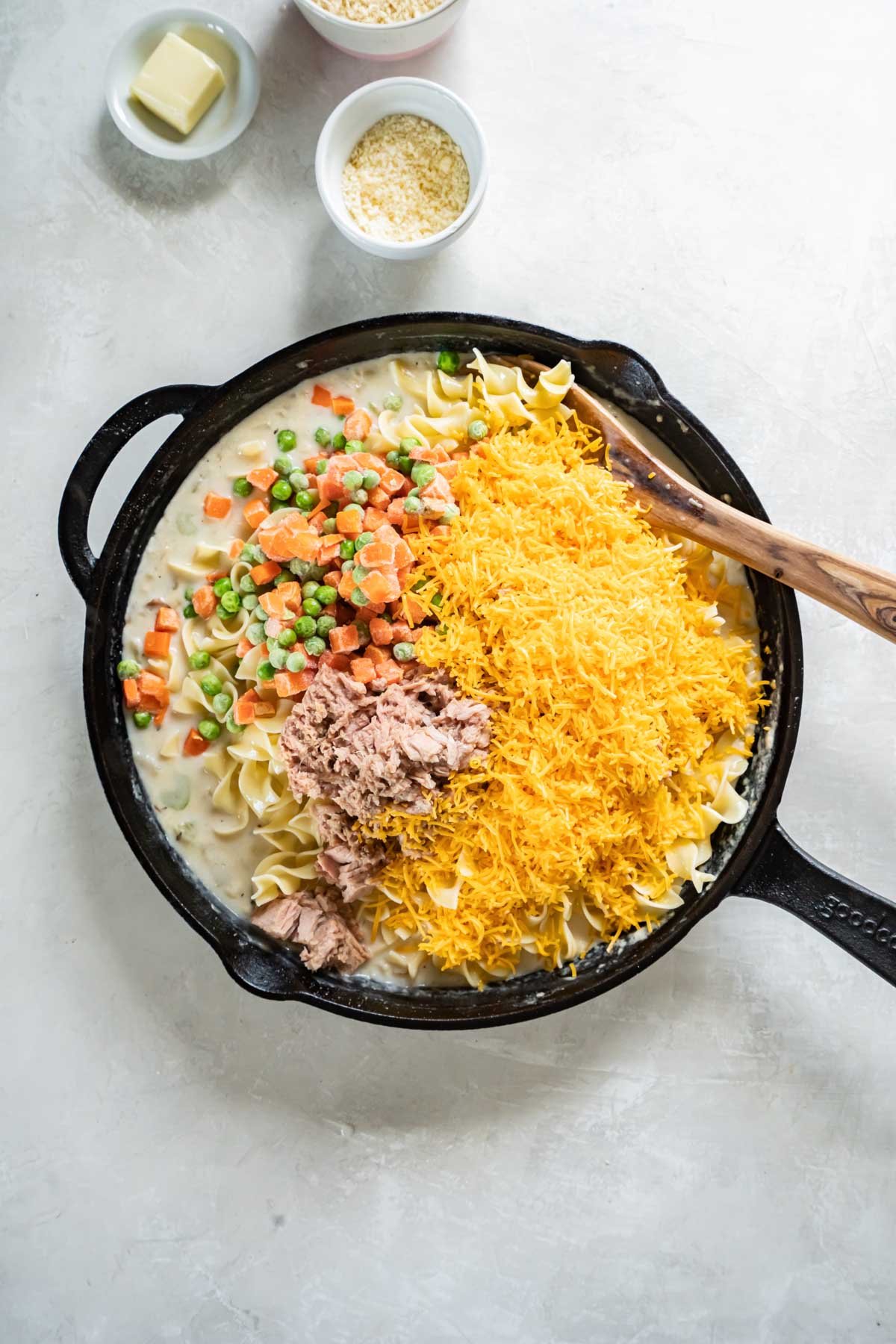 Tuna, carrots, peas, noodles and cheese added to skillet.
