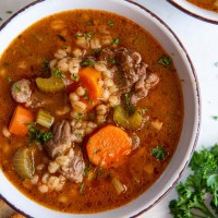 Bowl of instant pot beef barley soup.