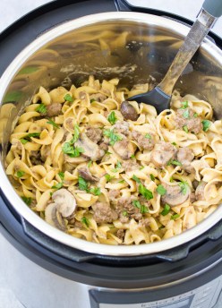 Easy beef stroganoff in an instant pot, with a serving spoon.