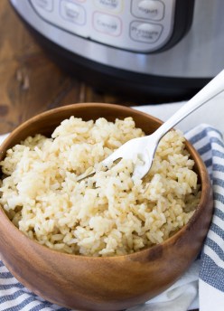 Instant Pot brown rice in a wooden bowl.