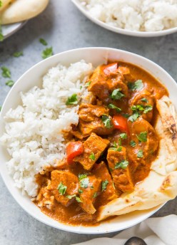 butter chicken served with rice and naan