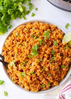 mexican rice in serving bowl with instant pot in background