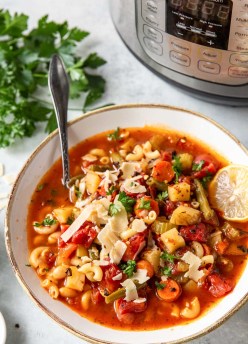 Minestrone in a serving bowl with instant pot behind.